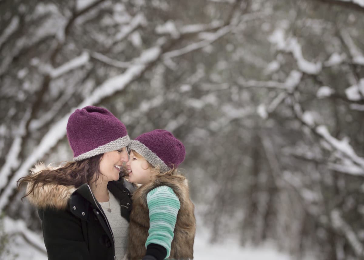 Heartwarming mother and child photograph from a wintertime photoshoot near grand rapids