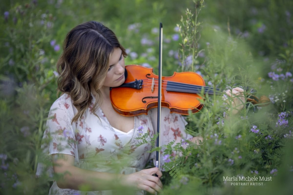 senior picture playing violin in Michigan park