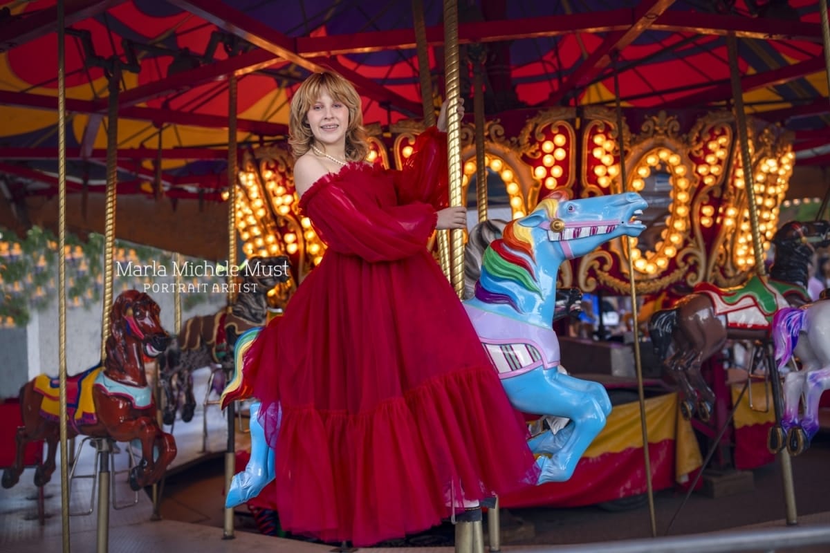 Michigan high school senior picture in red dress on a carousel in Detroit