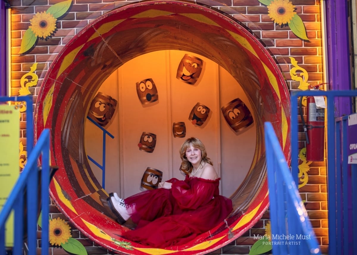 Colorful and fun high school senior photo in Michigan fun house at a Detroit-areacarnival