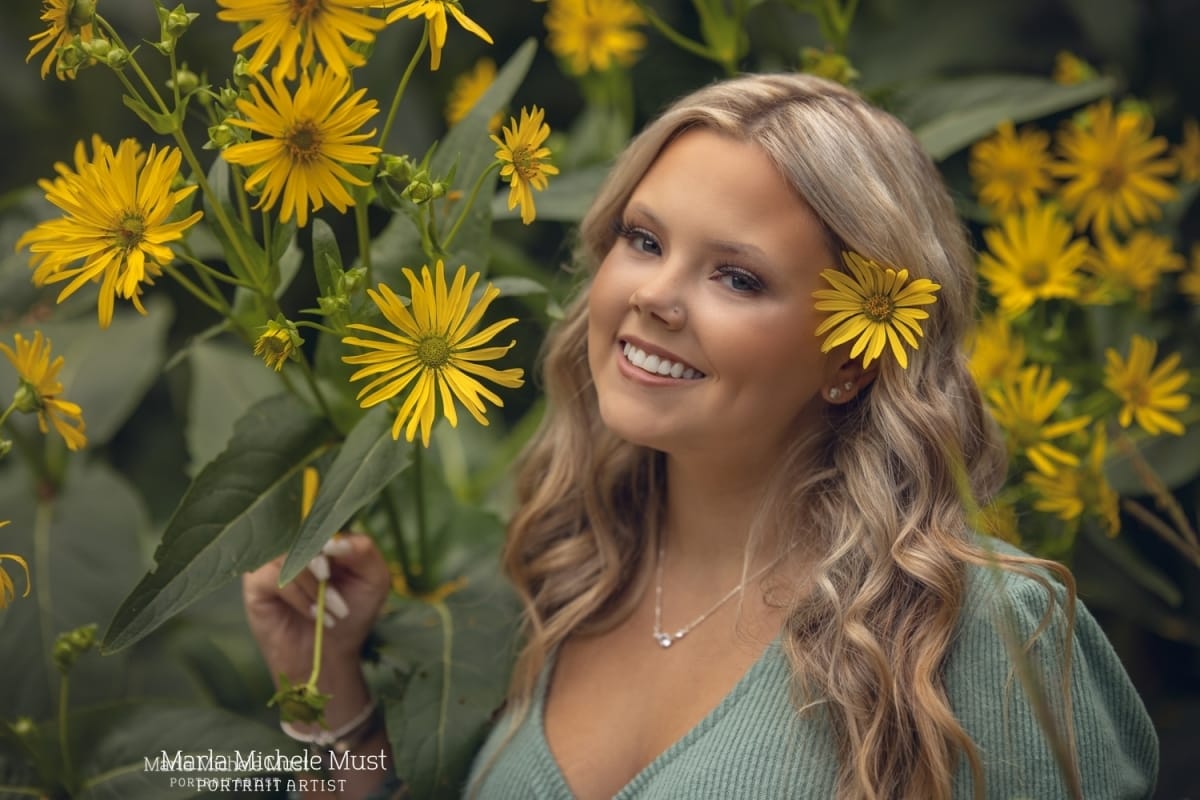 senior photo with yellow flowers in a Detroit garden taken by a skilled Michigan high school portrait photographer.