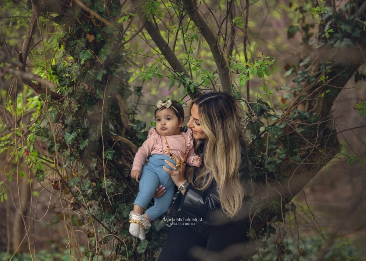 A family photoshoot of a mother and her baby sitting in the local wilderness near Birmingham.