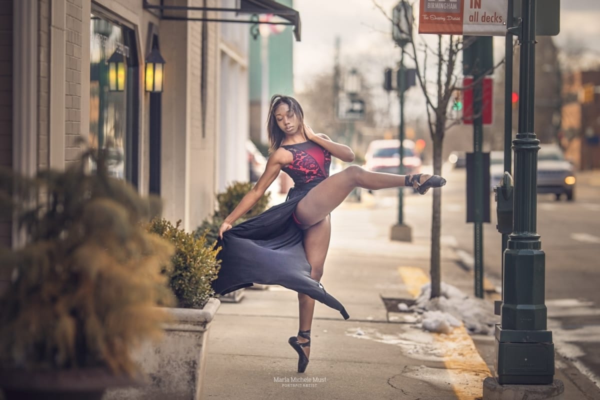 Dancer's effortless pose with one leg in the air shines in this captivating photo from a Detroit dance photoshoot.