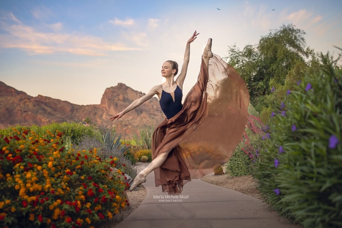 Dancer's leap is skillfully captured by a Detroit photographer during a captivating dancer photoshoot in a Michigan metro area, the fabric of her skirt flowing in the air. .