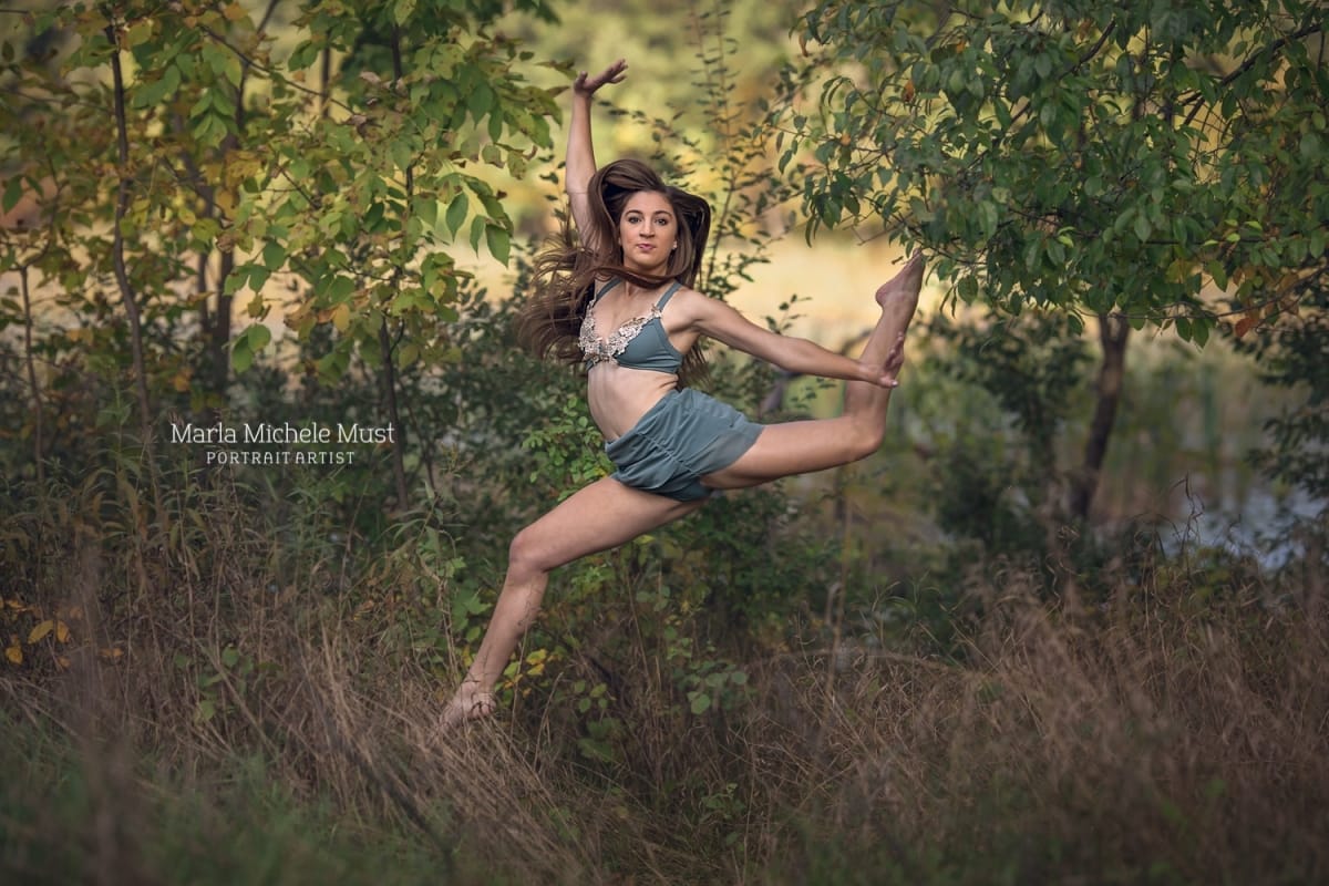 Detroit-area High school senior photographer captures the portrait of a girl leaping in the air