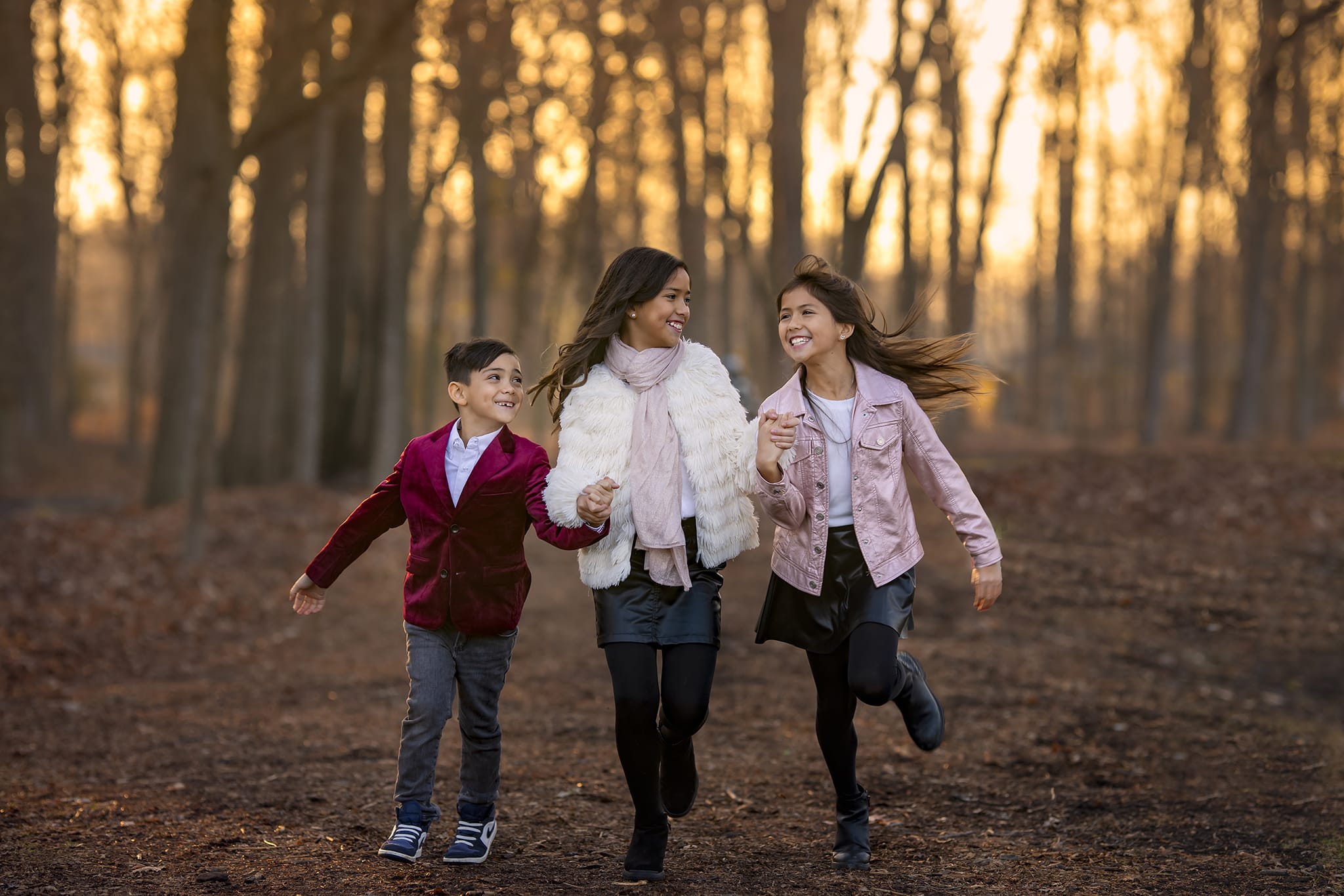 Michigan photographer's photo of three siblings in woods