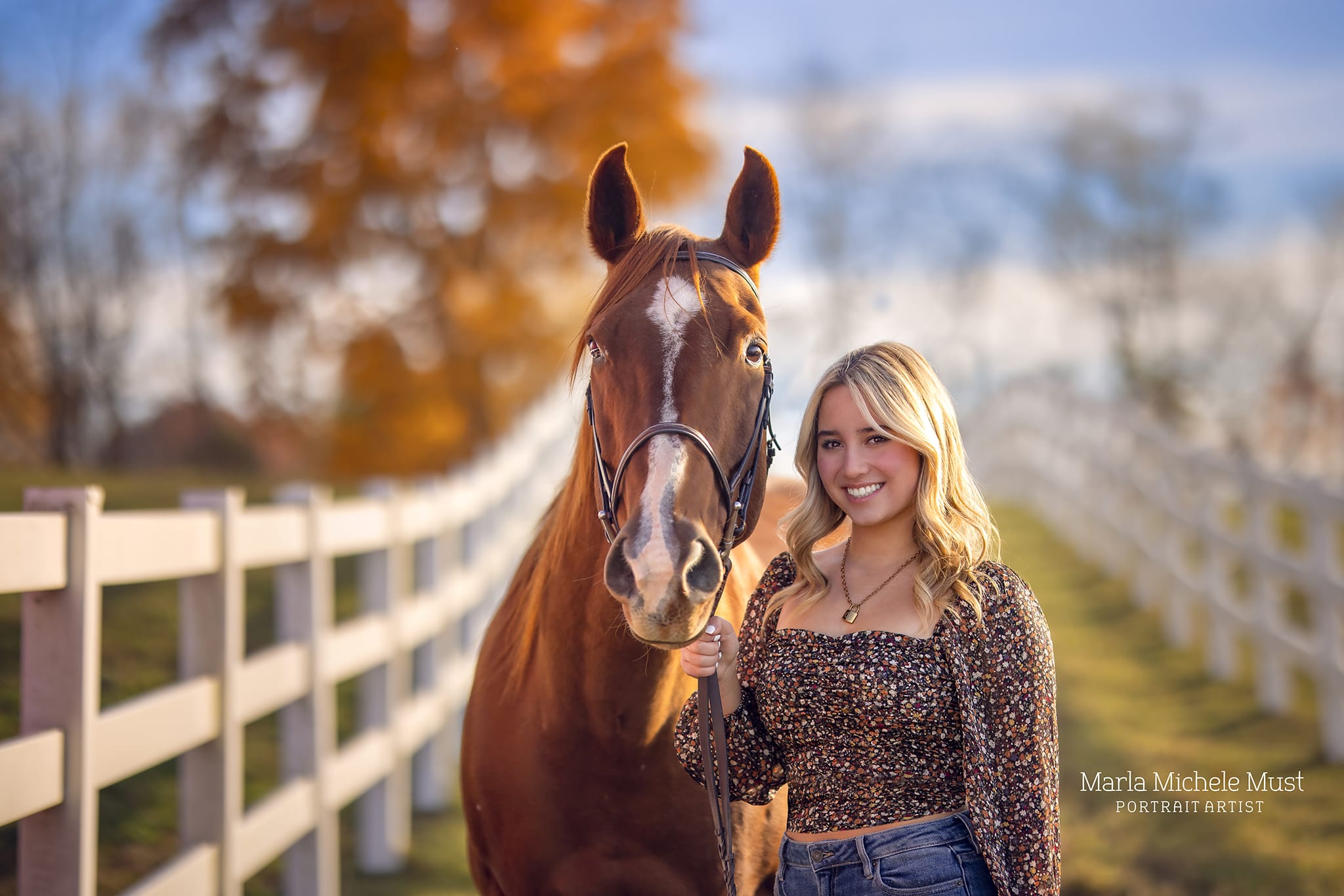 Detroit equine photographer's captivating shot: Woman standing by horse during autumn, beside a fence.