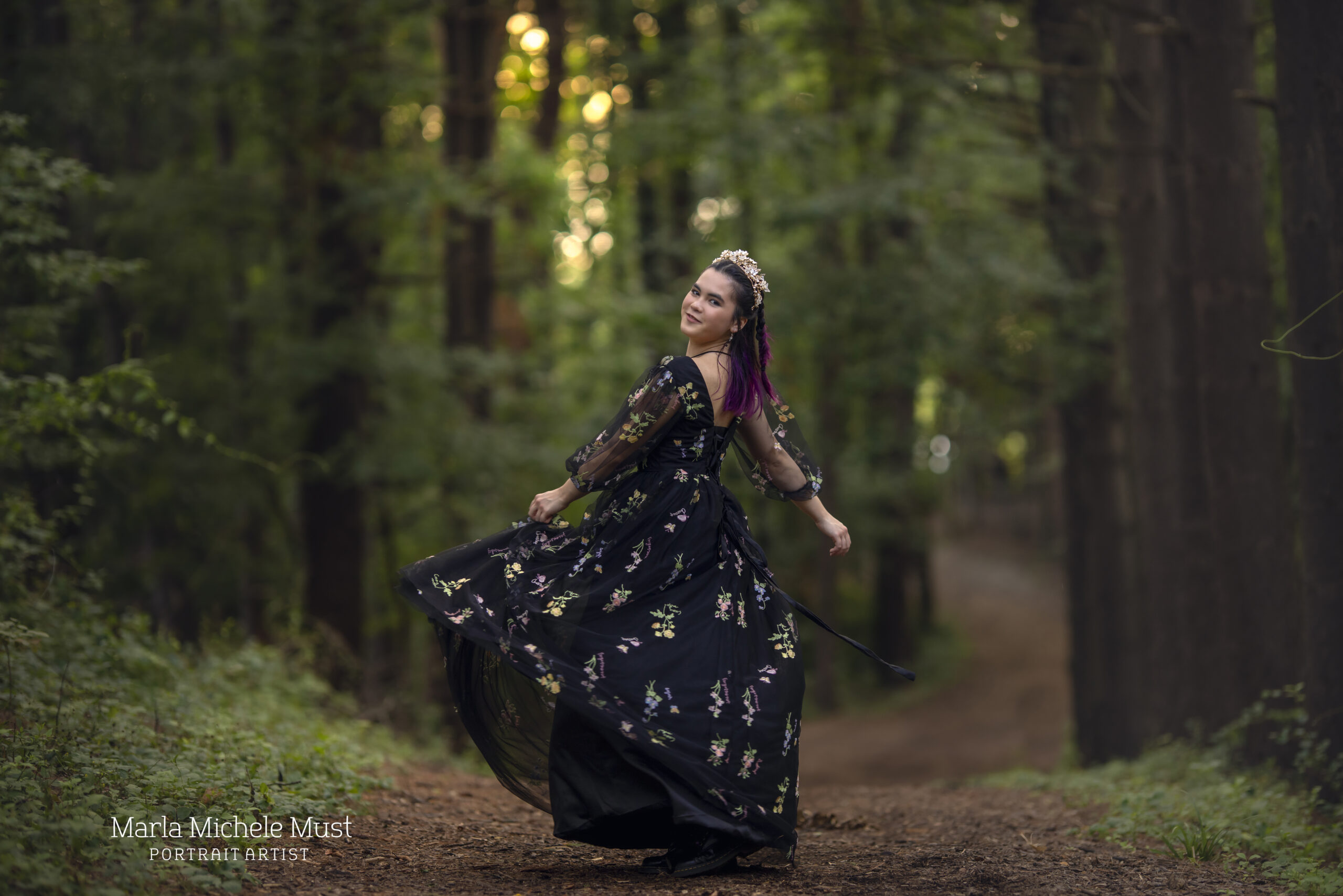 Dancer twirls in a flowy dress in a Detroit forest during a dance photoshoot, taken by a Michigan dance photographer.