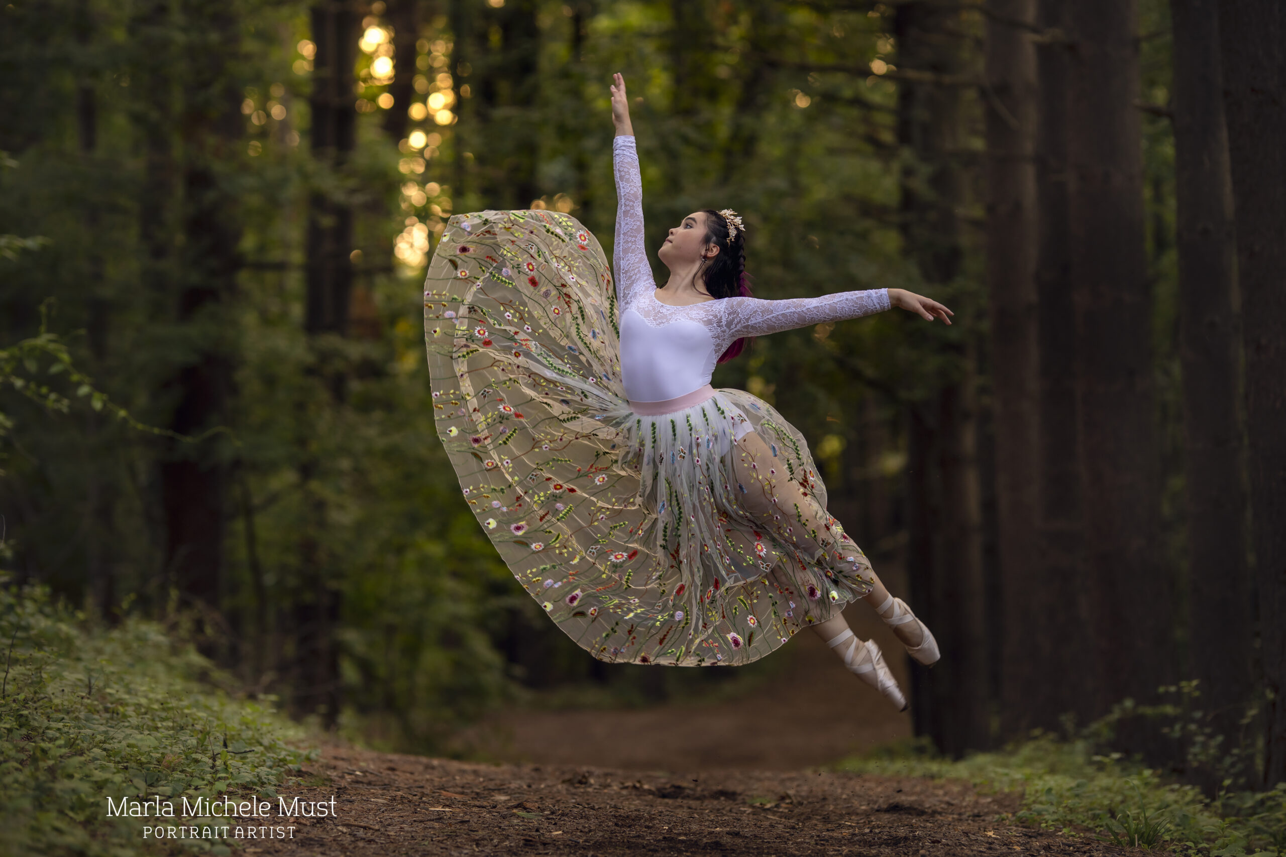 Dancer tosses her skirt in the air and jumps during a dance photoshoot, taken by a Michigan dance photographer.